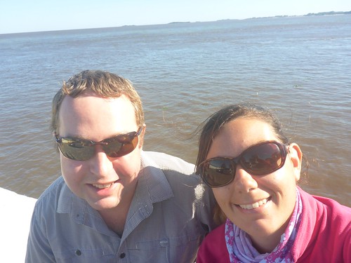 Us in front of the brown river